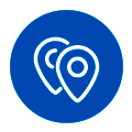 multi-sites Deux icônes de repères de carte qui se chevauchent, à l'intérieur d'un badge circulaire bleu bordé de blanc